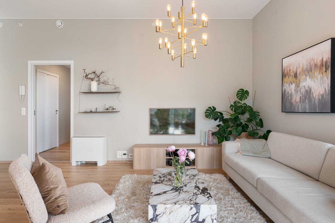 Elegant living room featuring minimalist design, plush furniture, and stylish lighting.