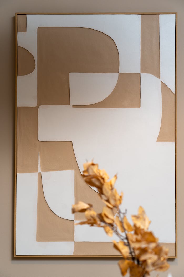 Elegant minimalist abstract artwork in a contemporary Dubai interior with neutral tones and dried floral accents.